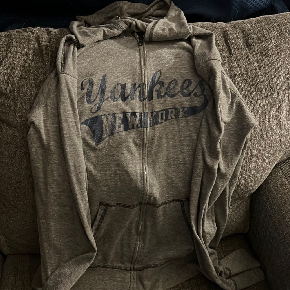 Light zipped up New York Yankees jacket with hood